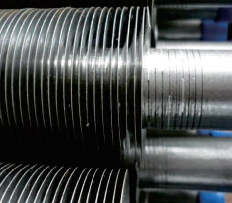 Industrial heat exchanger tubes showing plain and extended surface geometries